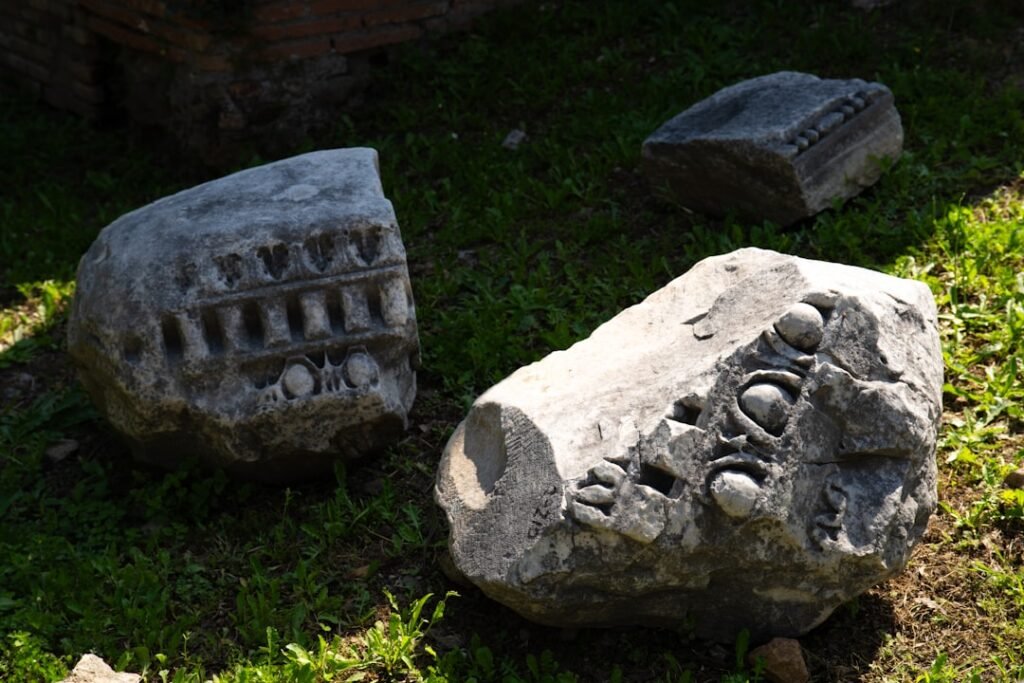Ancient pandemic societal collapse: Archaeological excavation of a mass grave site from the Justinian Plague era, showing human remains and historical context.