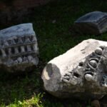 Ancient pandemic societal collapse: Archaeological excavation of a mass grave site from the Justinian Plague era, showing human remains and historical context.